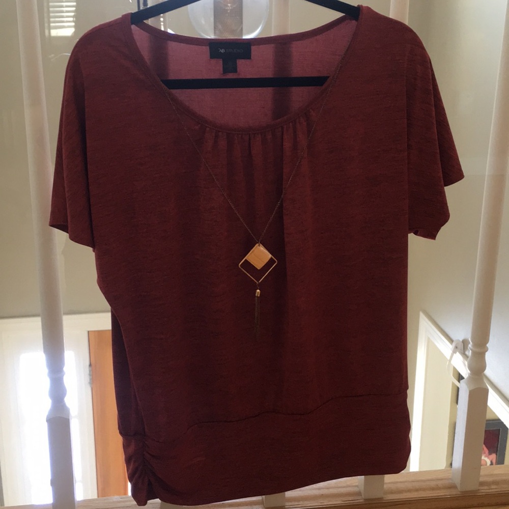 Textured red shirt with attached necklace